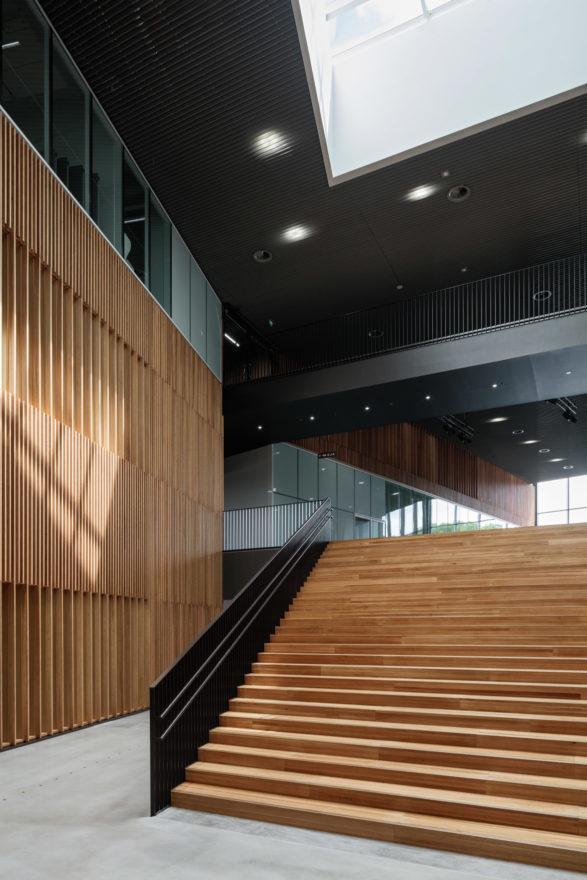 The main lobby with wooden surfaces in the Aalto University Väre Building for The School of Art, Design and Architecture, designed by Verstas Architects.