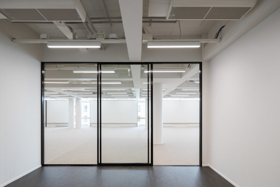 The new office of Verstas Architects, designed by ourselves. Minimalist glass wall.